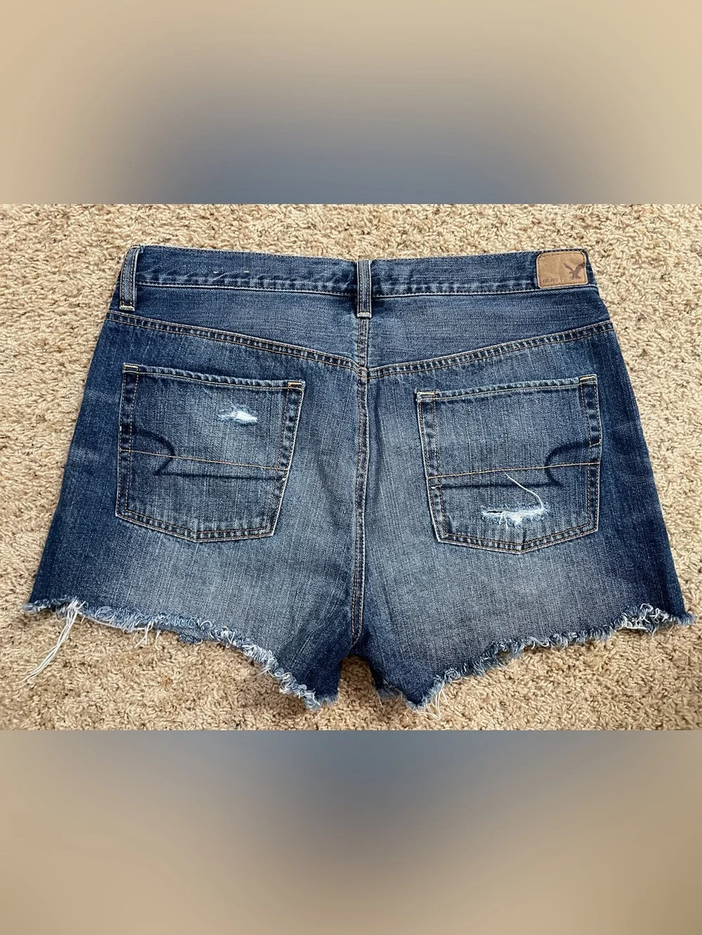 Women’s American Eagle blue jean denim destructed cutoff shorts size 10/12 -READ